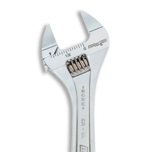 Close-up of a metal adjustable wrench with measurement markings on the jaw.